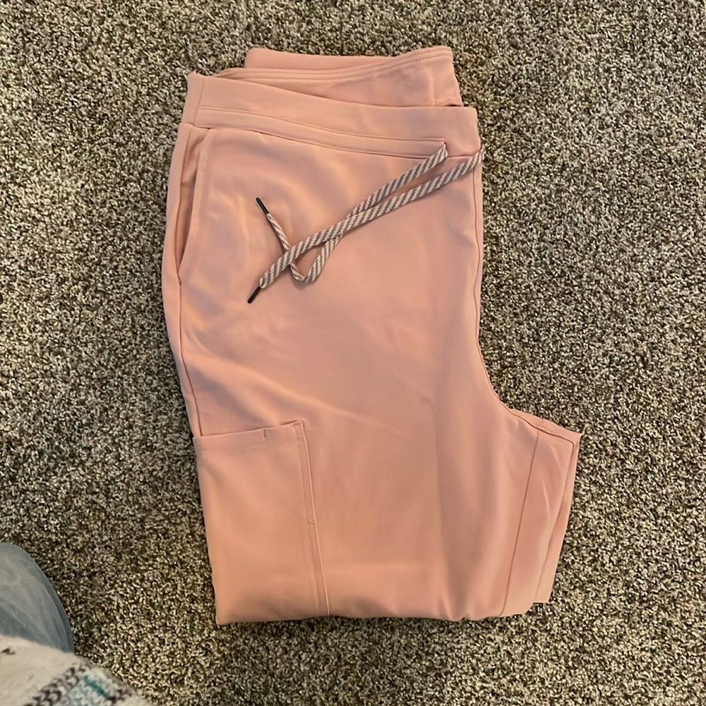Jaanuu scrub bottoms, a light blush pink color